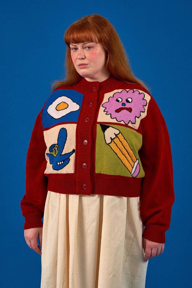model in a unique patchwork cardigan with playful designs