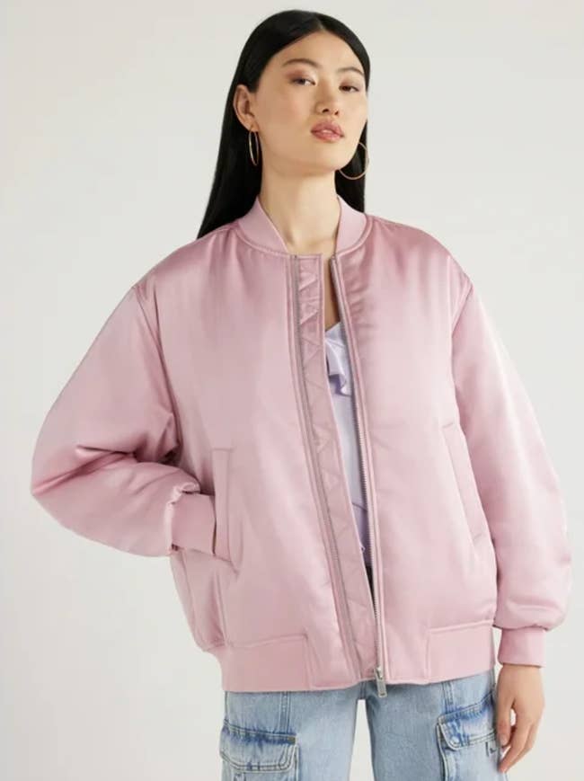 model wearing pink bomber jacket