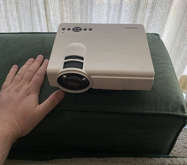 reviewer photo of the mini projector
