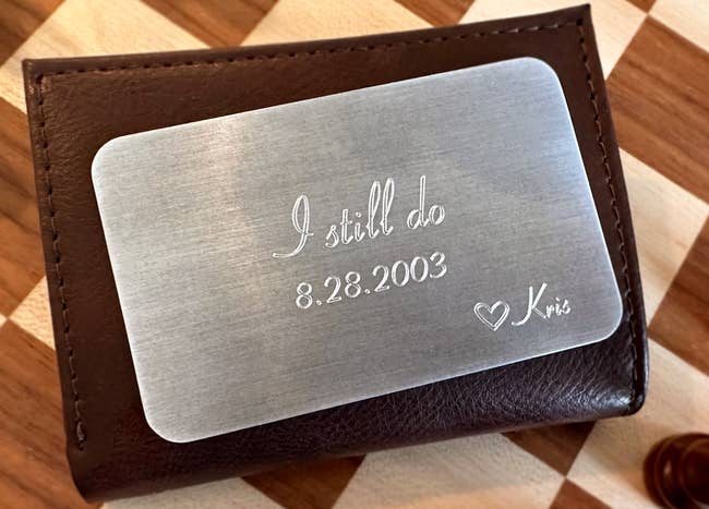 aluminum card shaped like credit card with words i still do and date of wedding with a heart and the name kris on the bottom