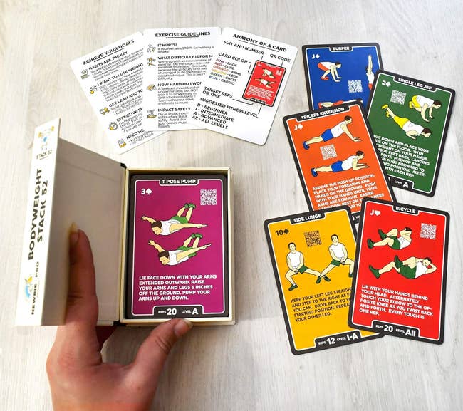 an unfastened container with the paper platform wrong and cards of antithetic colors featuring antithetic exercises connected each