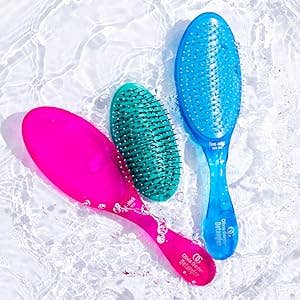 two hairbrushes one with the bristle cushion removed