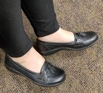 Reviewer wearing black shoes