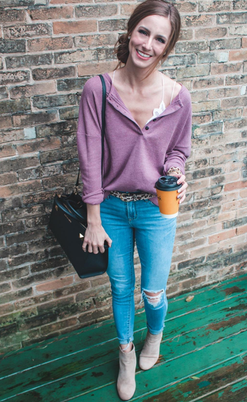 Reviewer wearing the purple henley with jeans and boots