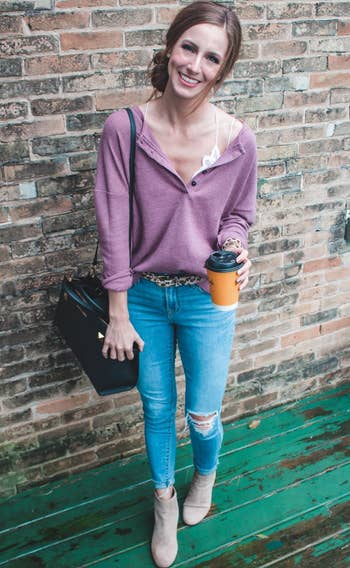 Reviewer wearing the purple henley with jeans and boots