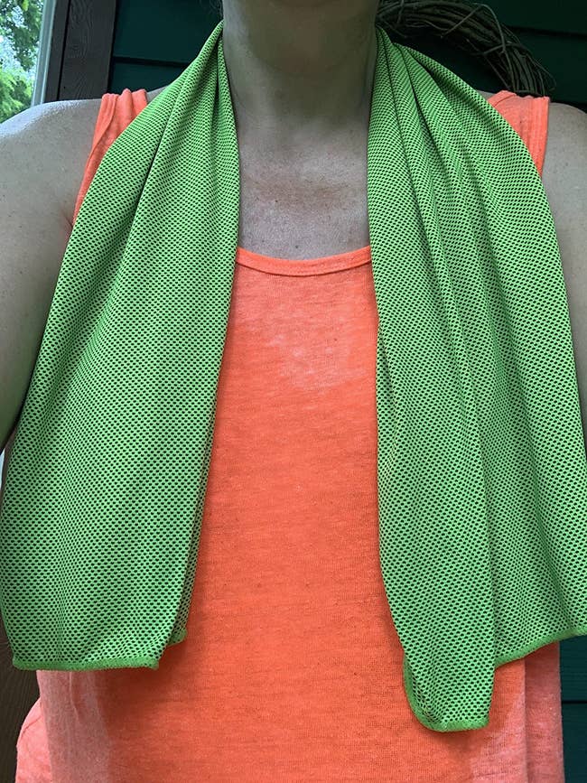 a reviewer wearing the green towel