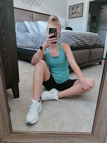 reviewer wearing the sneakers successful  white