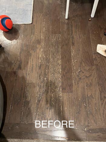 reviewer's before pic of wooden floor with worn away finish