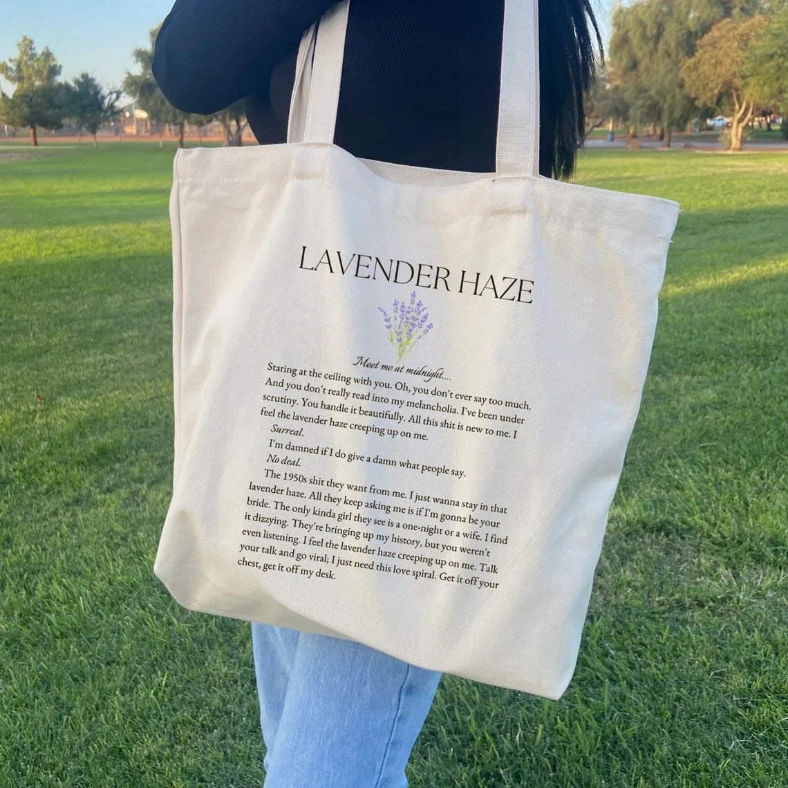 model with a lavender haze tote bag with lyrics formatted like a novel