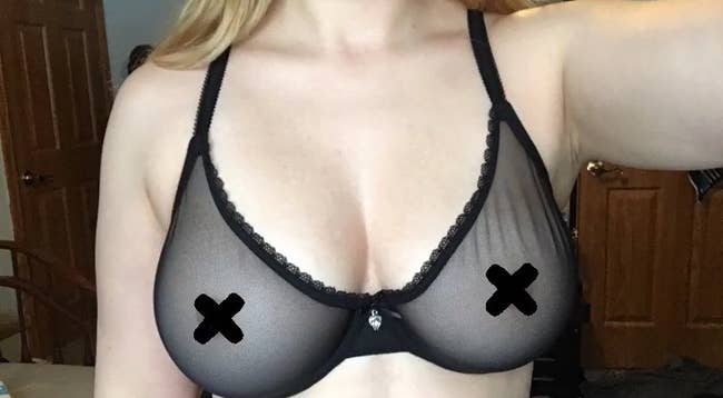 reviewer wearing the sheer bra in black