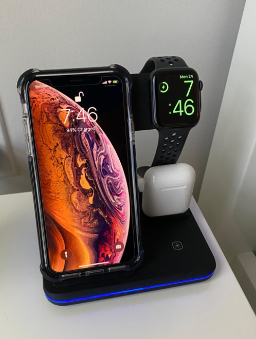 reviewer's stand charging three devices 