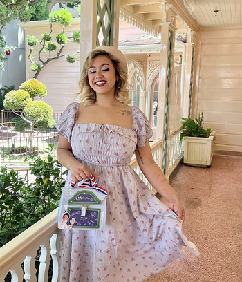 another reviewer wearing the gray dress