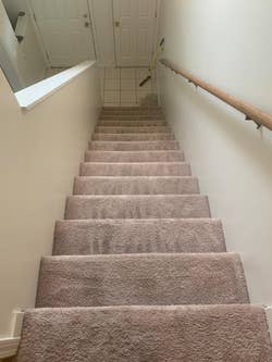 an after photo of a reviewer's staircase covered without fur