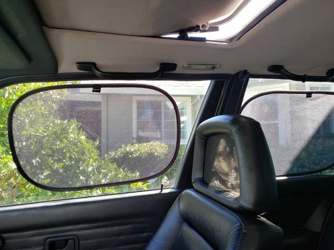reviewer image of a stick-on shade on two car windows