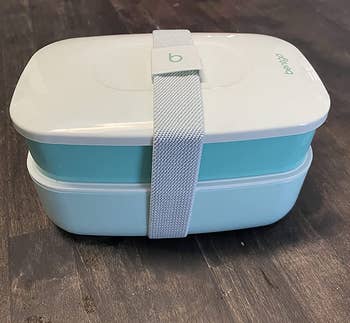a reviewer photo of the bento box layers stacked with lids on top 