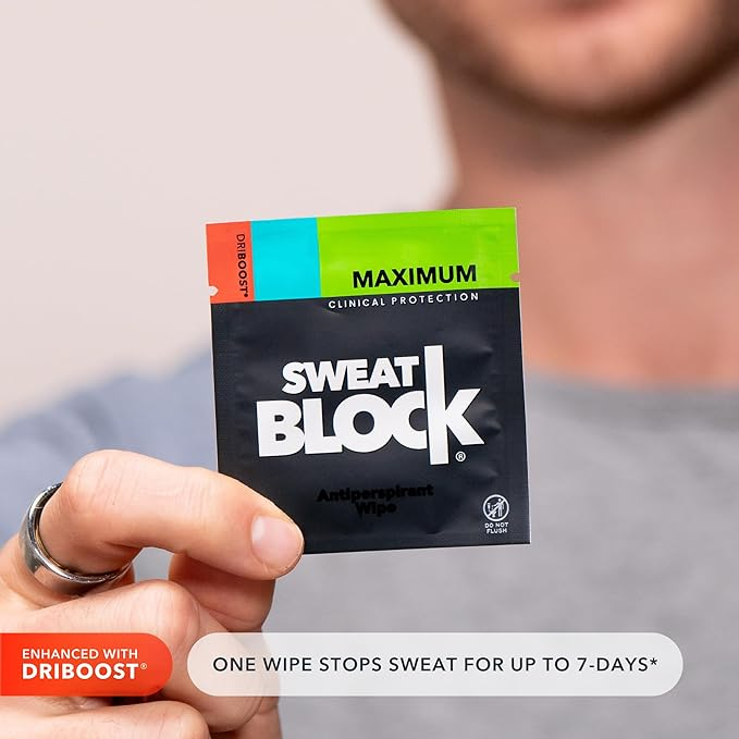 person holding up SweatBlock packet with wipe inside