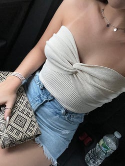 another reviewer wearing the cream version tucked into denim short