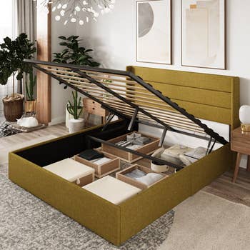 Storage furniture with lifted framework reveals organized compartments containing baskets and linens, acceptable successful a stylish chamber with modern decor