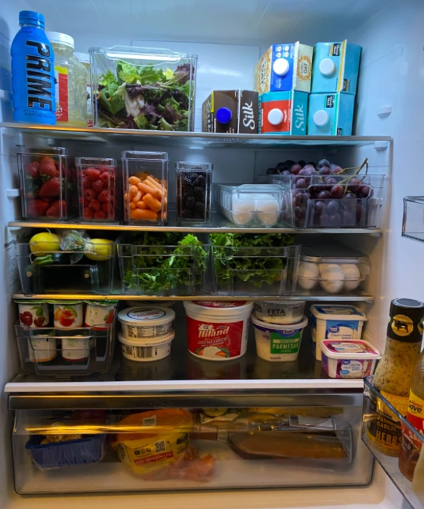 reviewer's organized fridge with clear containers 