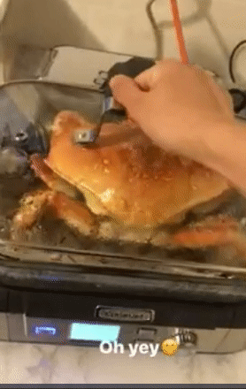 gif of reviewer lifting the lid off the steamer to reveal a giant cooked crab