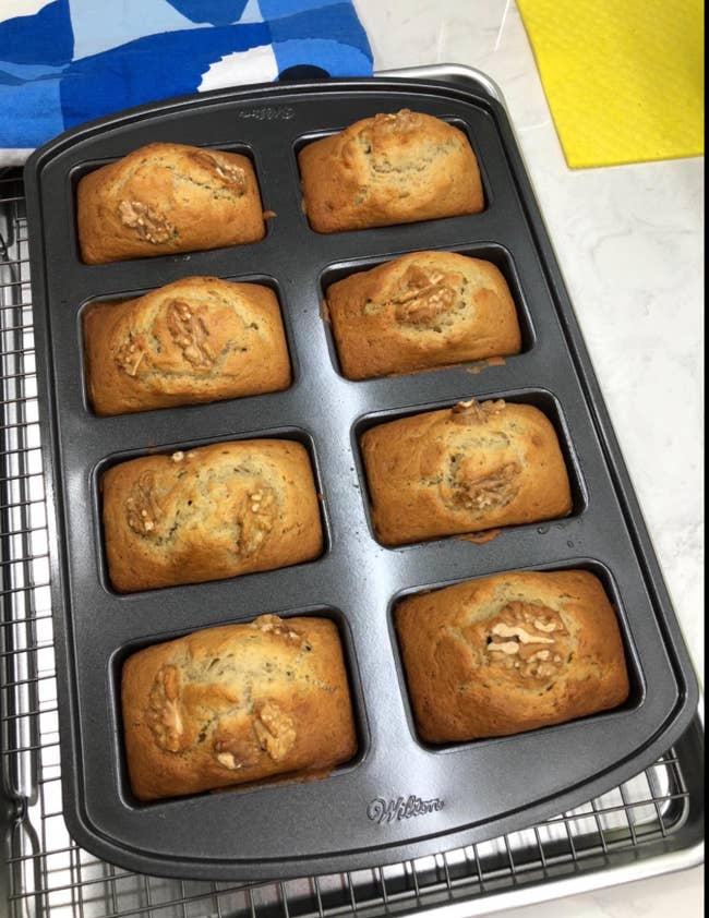 Reviewer image of eight small rectangular banana bread loaves in the pan 