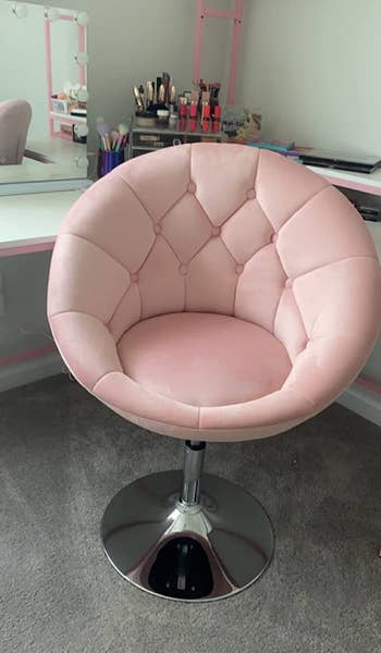 Reviewer image of product in pink velvet on carpet and in front of white vanity