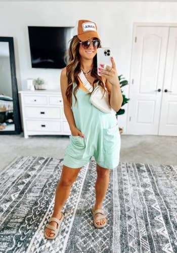 reviewer in a casual mint romper