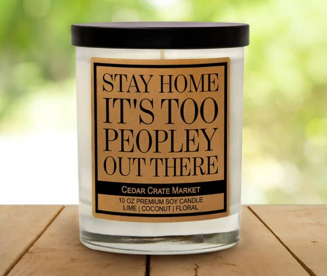 A candle with a label that says 