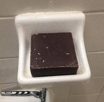Reviewer image of the brown square soap in dish