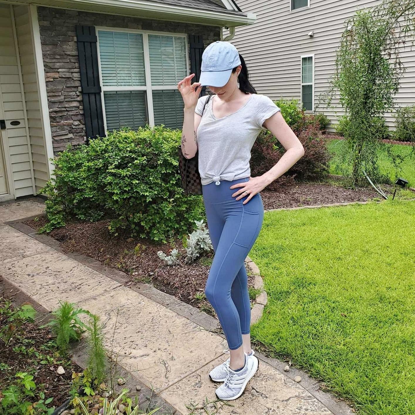 reviewer wearing the bluish  leggings outside