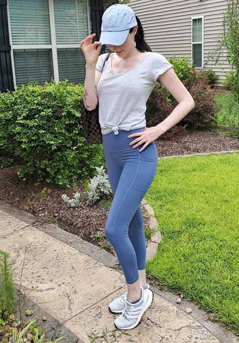 reviewer wearing the bluish leggings outside