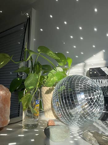 reviewer image of the disco ball reflecting onto a wall in the daylight
