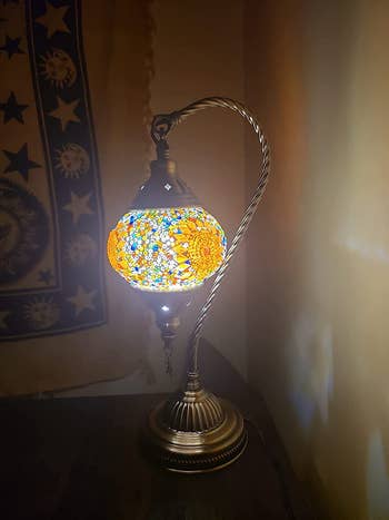 The light on a nightstand glowing yellow