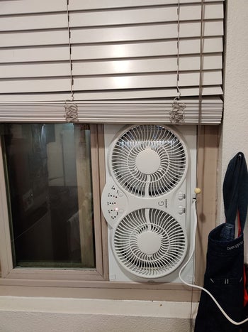 reviewer photo of window fan installed vertically
