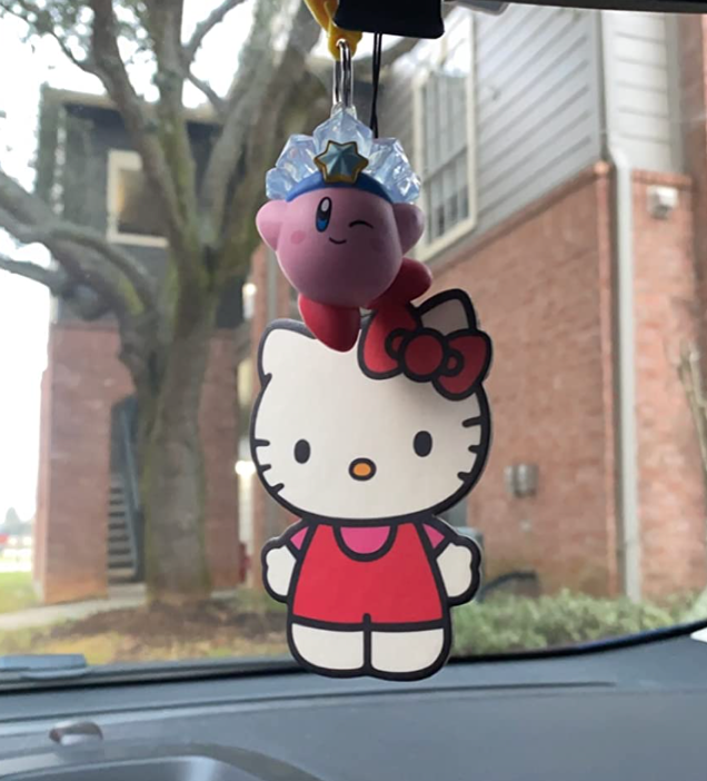 Reviewer photo of the air freshener on their rear view mirror
