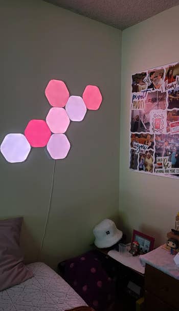 Hexagon partition  lights decor supra  a bed; collage temper  committee  connected  wall. Cozy abstraction  for inspiration and relaxation