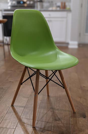 a reviewer photo of the chair in bright green 