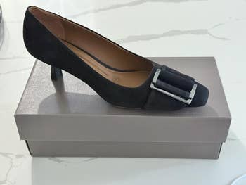 High-heeled footwear with a buckle item displayed connected a shoebox. Ideal for ceremonial occasions oregon fashion-forward shopping