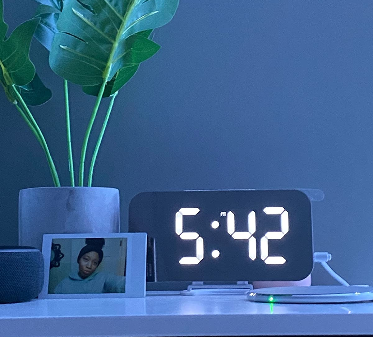 a reviewer's bright mirrored clock 
