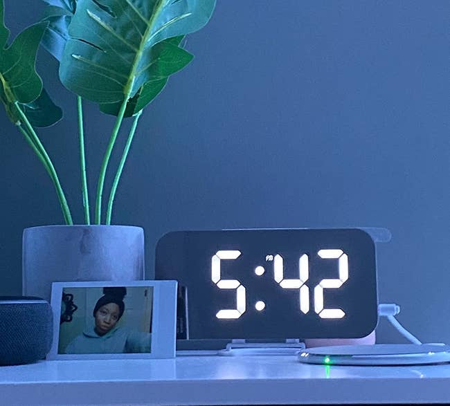 a reviewer's bright mirrored clock 