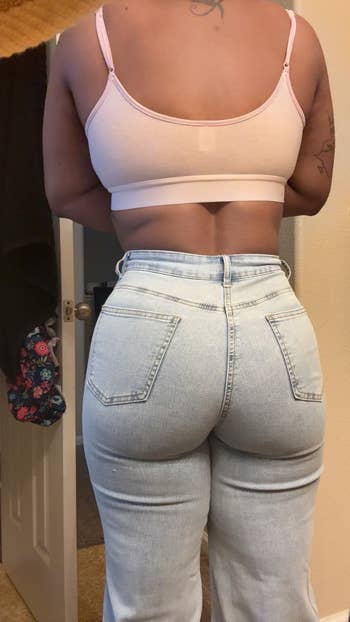 Person wearing airy  denim pants and a vessel  top, lasting  successful  a casual indoor setting