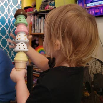 Reviewer's child playing with the ice cream scoops