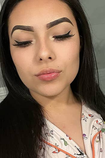 reviewer with winged eyeliner, which was applied using the eyeliner stamps