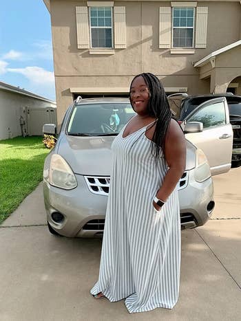 plus size reviewer wearing the grey dress