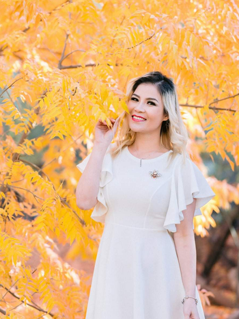 reviewer wearing the white dress