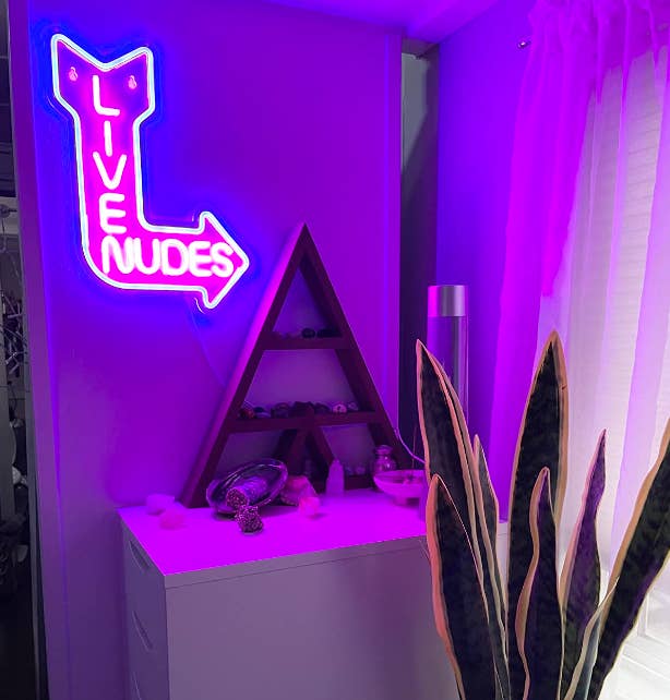 reviewer image of live nudes sign on wall