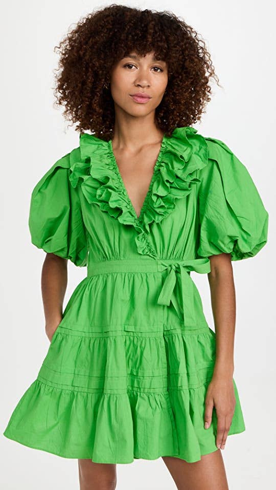 model in short puff sleeve dress with ruffle v neck