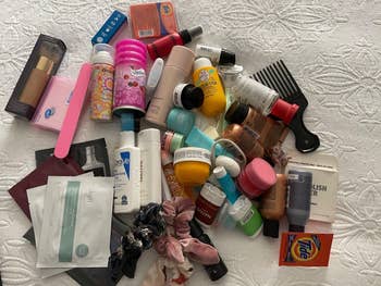 a pile of toiletry products spread out on surface