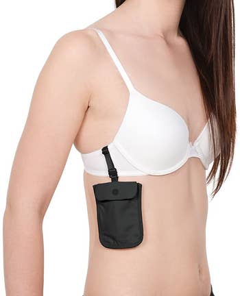 the small pouch attached to the side of a bra