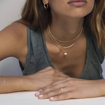 close up of model wearing the necklace